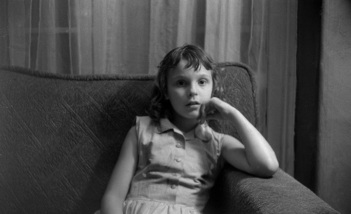 Mary Lou on couch.