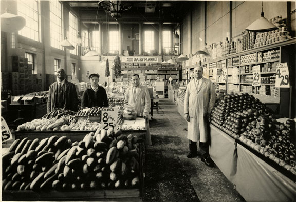 Grandfather on right in his grocery store in a former bank - 1936.